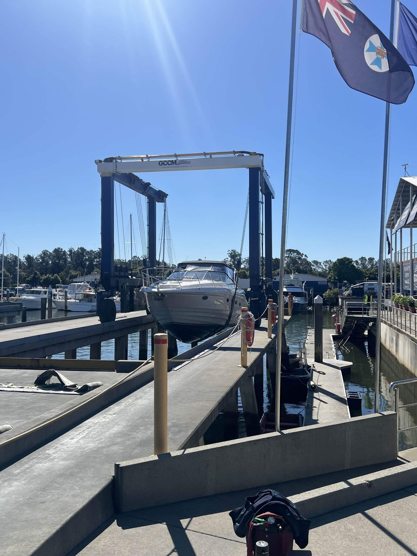 Cruiser in the travel lift at a Gold Coast marina